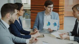 Healthcare RCM professionals reviewing financial workflows, resolving claim denials, reducing AR days, and improving revenue performance through strategic revenue cycle management.